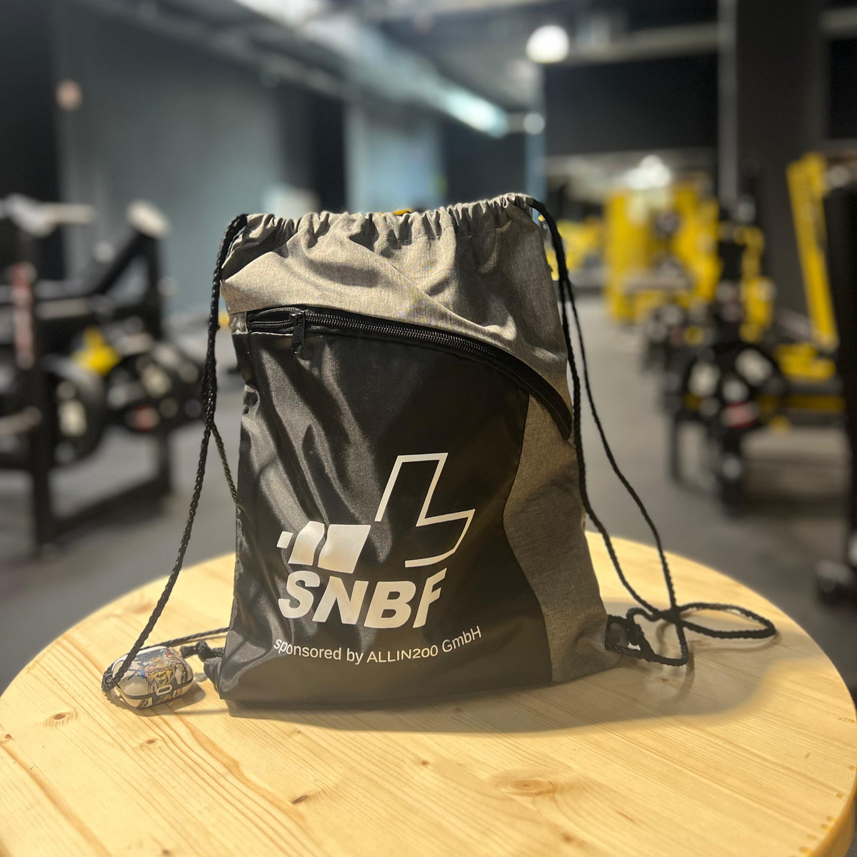 Black drawstring bag with &#39;SNBF&#39; logo